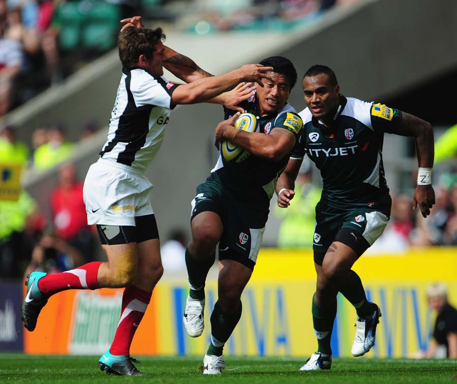 London Irish centre Elvis Seveali'i is tackled by Alex Goode