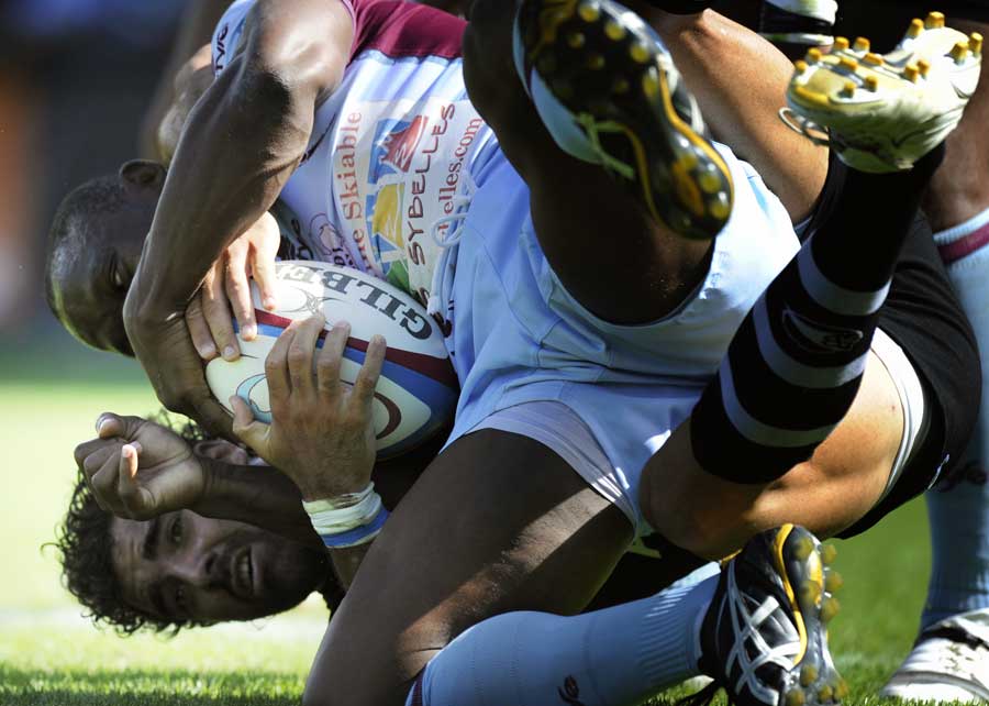 Bourgoin's Silvere Tian is tackled by Jean-Joseph Marmouyet 