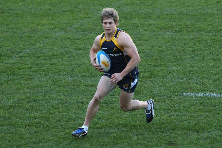 Australia wing James O'Connor runs with the ball during training