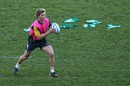 Australia centre Berrick Barnes runs with the ball during training