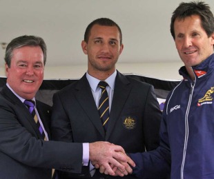 Austrailan Rugby Union chief executive John O'Neill, Wallabies fly-half Quade Cooper and coach Robbie Deans pose following the announcement of Cooper's decision to re-sign with the ARU, ANZ Stadium, Sydney, Australia, September 10, 2010