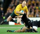 Australia's Stephen Moore is snared by an All Black tackler
