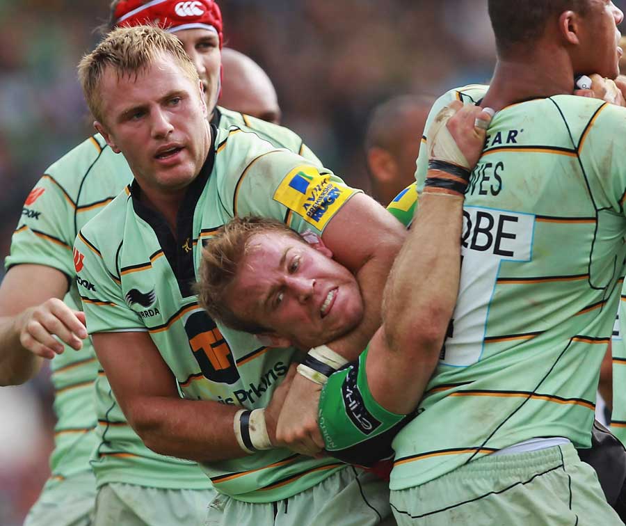 Northampton's Roger Wilson gets to grips with Quins' Will Skinner