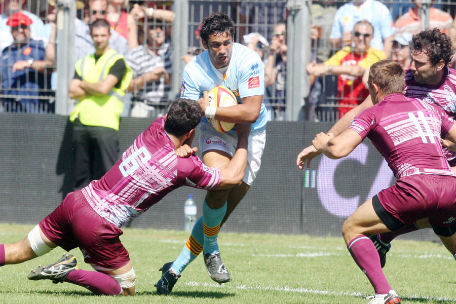 Perpignan centre Maxime Mermoz takes on the Bourgoin defence