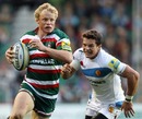 Leicester's Scott Hamilton shows his pace to elude Mark Foster
