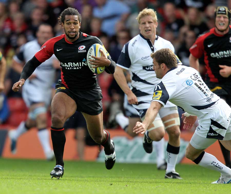 Saracens' Noah Cato stretches the Sale defence