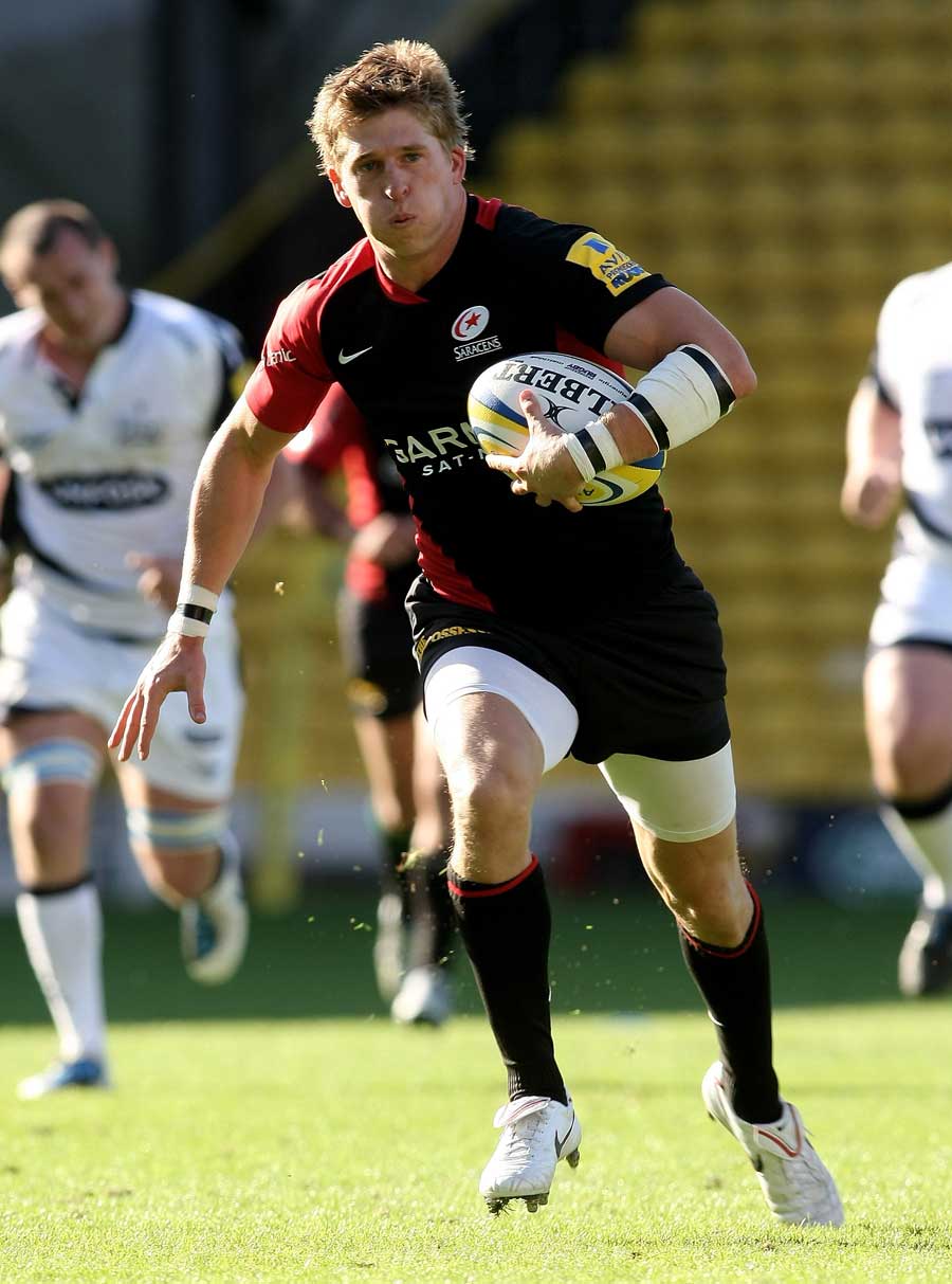 Saracens' David Strettle exploits a gap in the Sale defence