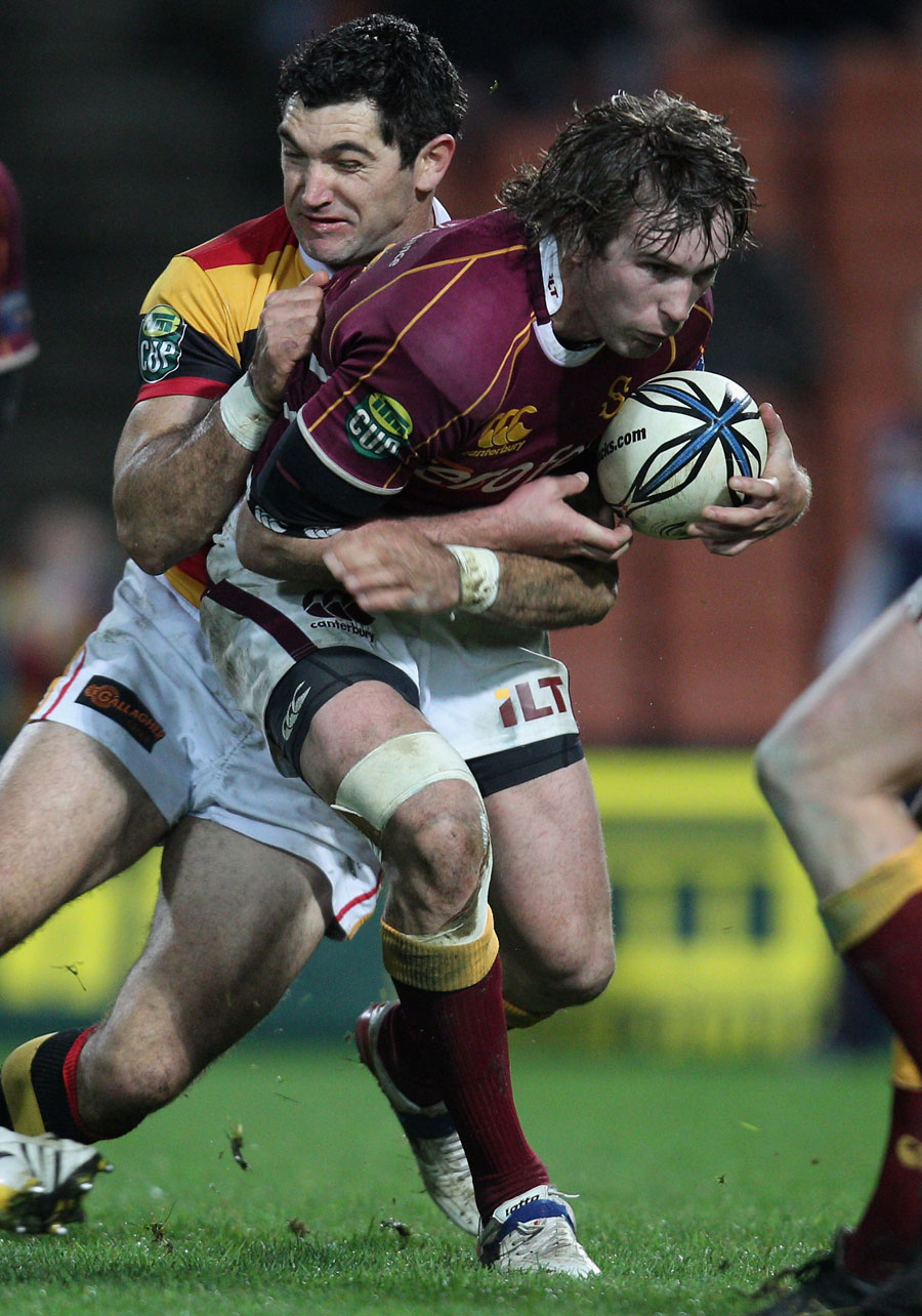 Southland's Matt Saunders is tackled by Stephen Donald