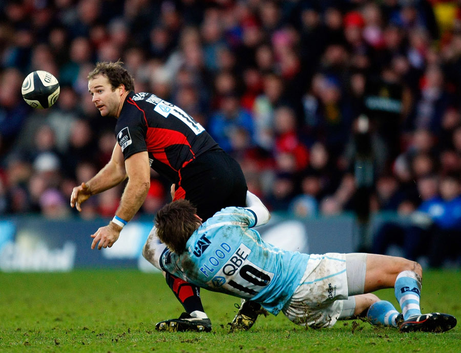Saracens' Rodd Penney of Saracens is tackled by Toby Flood
