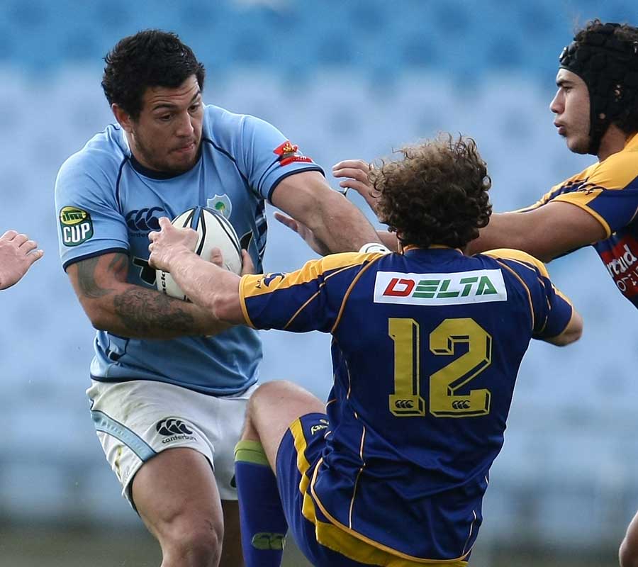 Northland's Rene Ranger smashes through the tackle of Andrew Parata 