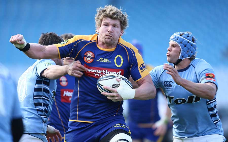 Otago flanker Adam Thomson breaks a Northland tackle