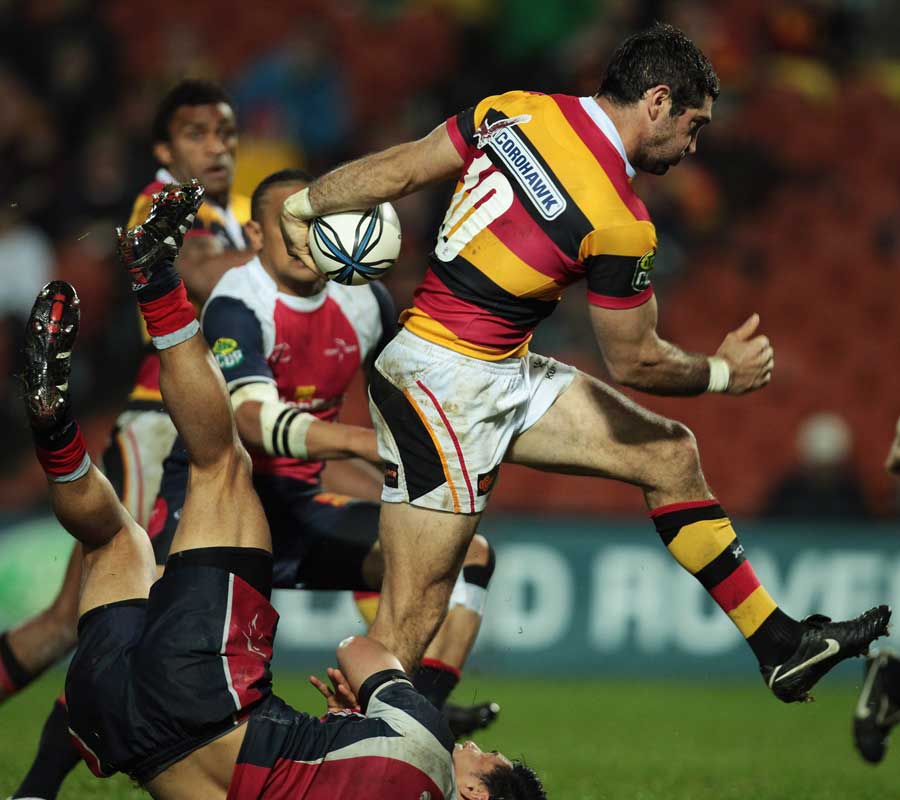 Waikato fly-half Stephen Donald smashes through a tackle