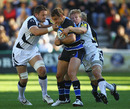 Bath's Olly Barkley is wrapped up by Kristian Ormsby and David Seymour