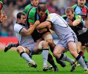 Quins' Tomas Vallejos is held by the Falcons defence