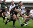 Northampton's Paul Diggin holds off the Exeter defence to score