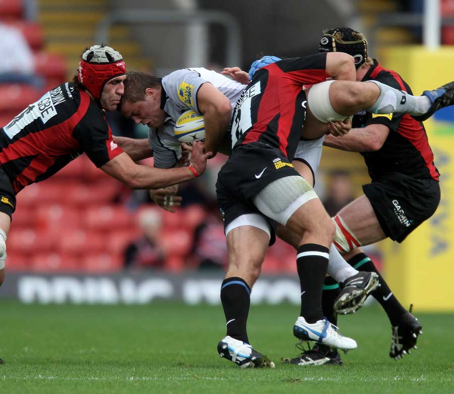 Leicester's Ed Slater is gang tackled by Kelly Brown, Schalk Brits and Hugh Vyvian