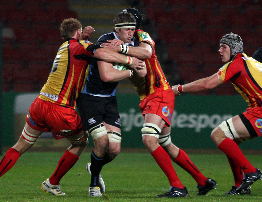 Glasgow's Richie Vernon tries to barge through the Dragons defence