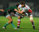 Ulster's Robbie Diack shrugs off a tackle from Gilberto Pavan