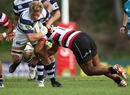 Auckland's Daniel Braid is tackled by the Counties Manukau defence