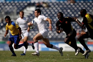 England's Kevin Barrett charges away from the Ugandan defence, England v Uganda, Rugby Sevens, Commonwealth Games, Delhi University, Delhi, India, October 11, 2010