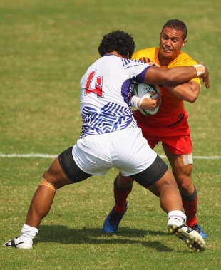 England's Dan Caprice is halted , England v Samoa, Rugby Sevens quarter-finals, Commonwealth Games, Delhi University, Delhi, India, October 12, 2010