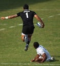 New Zealand's Liam Messam leaps clear of an England tackler