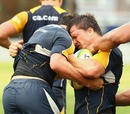 Australia centre Adam Ashley-Cooper feels the force of a collision during training