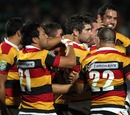 Waikato fly-half Stephen Donald is mobbed after scoring the winning try against Manawatu