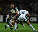 Ospreys centre James Hook attempts to find a way through the Irish defence