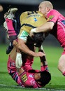 Castres' Matthieu Bonello is tackled by the Cardiff Blues defence