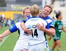 Tom Biggs turns to celebrate his opening try with his team-mates