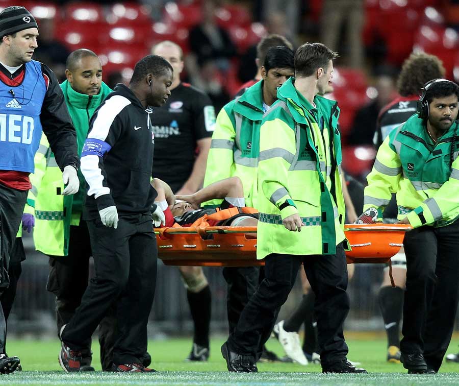 Saracens' Derick Hougaard is stretchered from the field