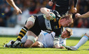 Wasps No.8 Andy Powell is taken down by John Barclay