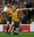 Chris Latham celebrates after scoring a try against Wales