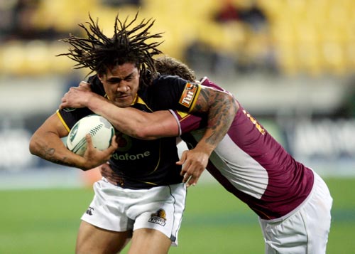 Rodney So'oialo of the Lions is tackled by Jamie Mackintosh of Southland 
