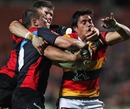 Trent Renata is tackled by Colin Slade and Willi Heinz