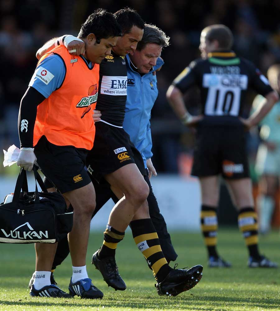 Wasps' Riki Flutey is helped from the pitch, London Wasps v Northampton Saints, Aviva Premiership, Adam's Park, High Wycombe, England, October 24, 2010