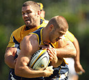 Drew Mitchell is tackled at Wallabies training