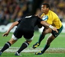 Australia scrum-half Will Genia is caught by the All Blacks' defence