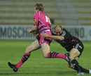 Dan Fish is tackled by Ludovic Mercier 