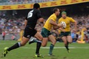 Australia fly-half Quade Cooper breaks away to score