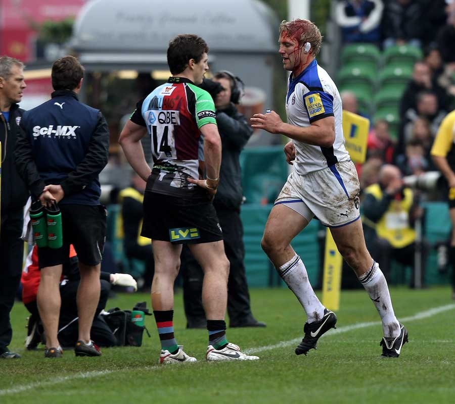 Bath flanker Lewis Moody leaves the field with a blood injury