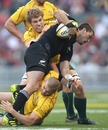 New Zealand's Cory Jane is shackled by Australia's Drew Mitchell and David Pocock