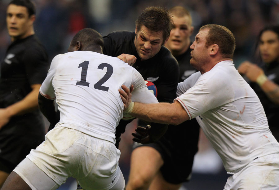New Zealand's Richie McCaw takes on the England defence