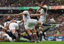 England scrum-half Ben Youngs boots the ball to safety