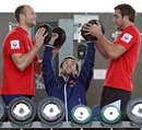 France scrum-half Morgan Parra lifts weights with a little help from Julien Bonnaire and Alexandre Lapandry