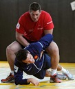 France centre Damien Traille is put through his paces by Jerome Thion