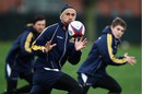 Quade Cooper takes the ball during training