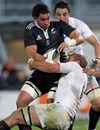 New Zealand Maori's Colin Bourke protects the ball