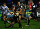 The Ospreys' Ashley Beck looks to offload in the tackle